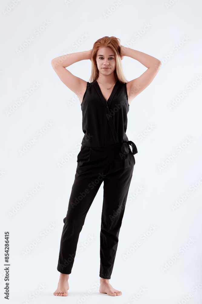 Young woman holding her hair on white background Young woman holding her hair on white background