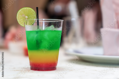 A Peruvian rainbow cocktail on the table. In Peru, this cocktail is called "Machu Picchu."