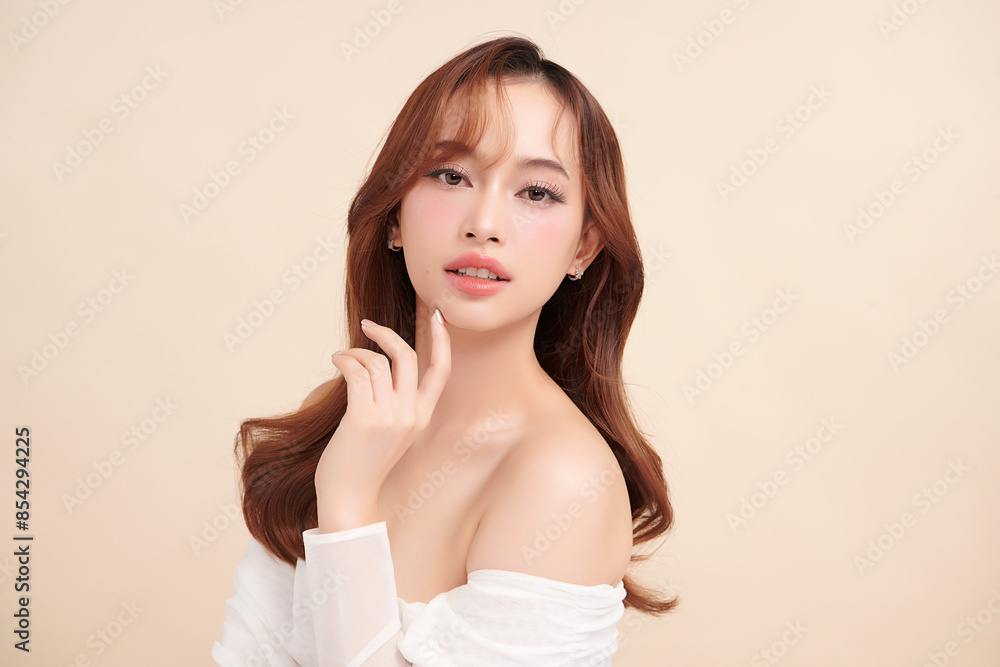 Beautiful young asian woman with clean fresh skin on beige background, Face care, Facial treatment, Cosmetology, beauty and spa, Asian women portrait.