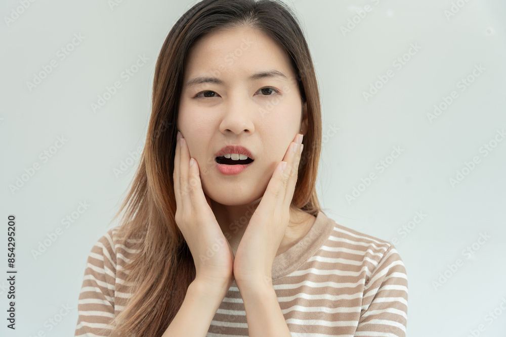Asian woman feel toothache from gingivitis, female suffer tooth, decay problems, dental care. sensitive tooth, decay problem, bad breath, Gingival Recession, Oral Hygiene instruction, tooth extraction Asian woman feel toothache from gingivitis, female suffer tooth, decay problems, dental care. sensitive tooth, decay problem, bad breath, Gingival Recession, Oral Hygiene instruction, tooth extraction