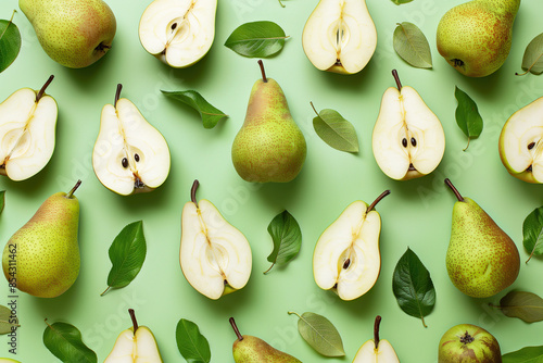 Healthy nutrition concept. Fresh pears, leaves and halves isolated on willow green background. Pop-art wallpaper, poster style. Close up. Studio shot photo