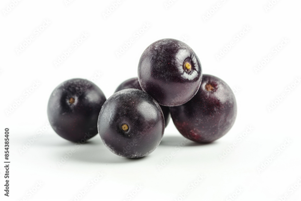 Closeup photo of a group of acai berries isolated on white Closeup photo of a group of acai berries isolated on white