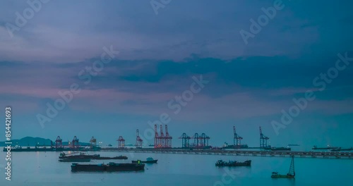 Wallpaper Mural Time-lapse Logistic shipping quay boat in twilight sky night Engineering crane depot at logistic export terminal control. Warehouse freight container yard quayside harbor port Logistics TimeLapse Torontodigital.ca