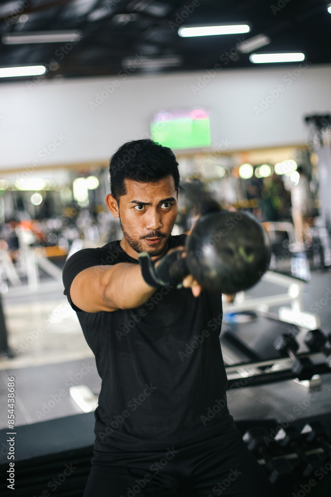 Young Asian Strong Man Lifting Heavy Barbell During Powerlifting Workout in Gym Young Asian Strong Man Lifting Heavy Barbell During Powerlifting Workout in Gym