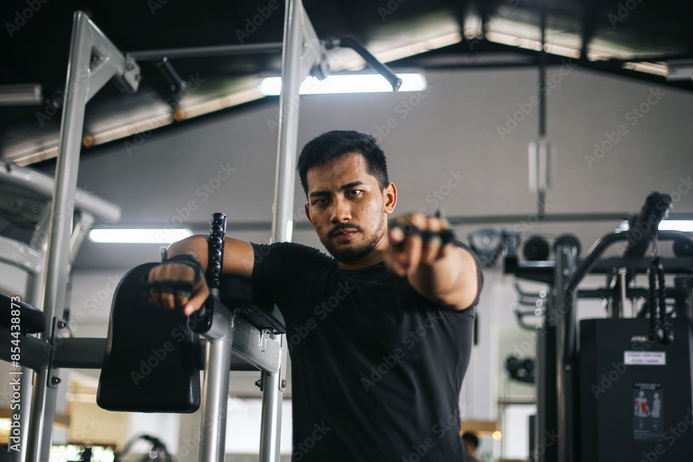Portrait of muscular man standing confidently at sport club gym while pointing at you. Healthy lifestyle concept. Portrait of muscular man standing confidently at sport club gym while pointing at you. Healthy lifestyle concept.