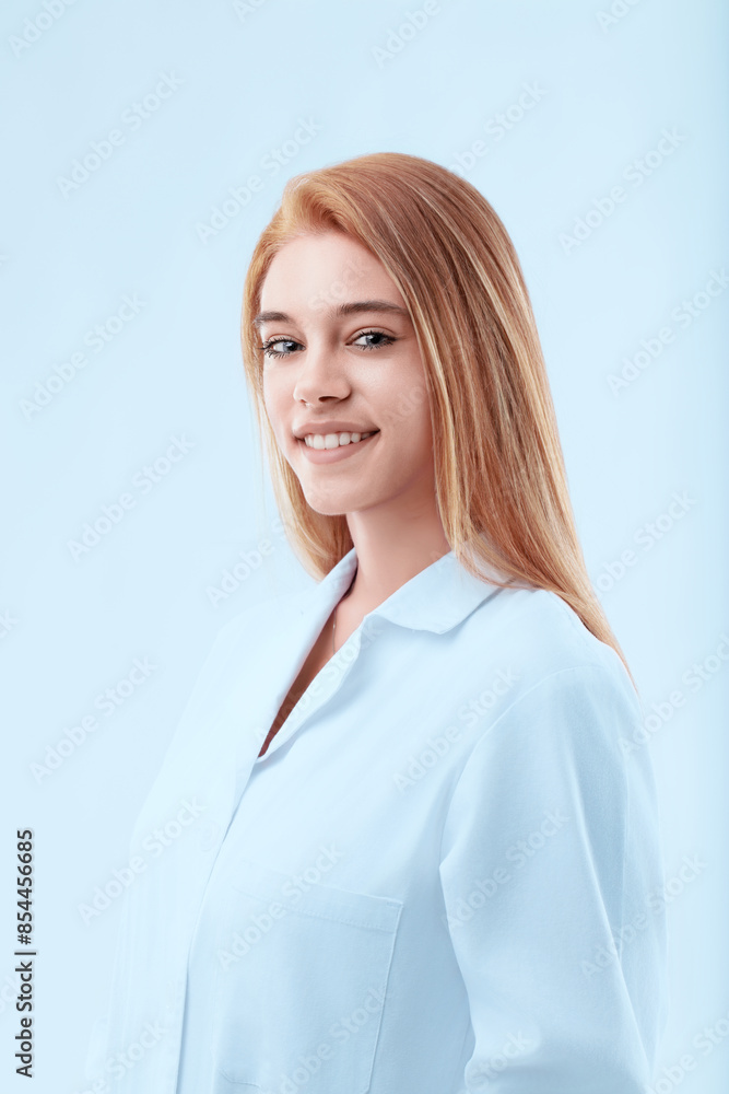 Young doctor woman smiling wearing lab coat on blue background Young doctor woman smiling wearing lab coat on blue background