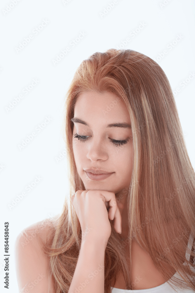 Beautiful young woman with long blonde hair resting chin on hand Beautiful young woman with long blonde hair resting chin on hand