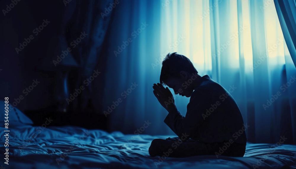 Person praying before going to sleep Person praying before going to sleep
