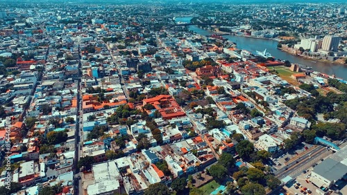Metropolitan cityscape of an old residential area with apartment buildings. Tropical natural landscape in the Dominican city. Aerial view of the houses. Summer city landscape from a bird's eye view. photo