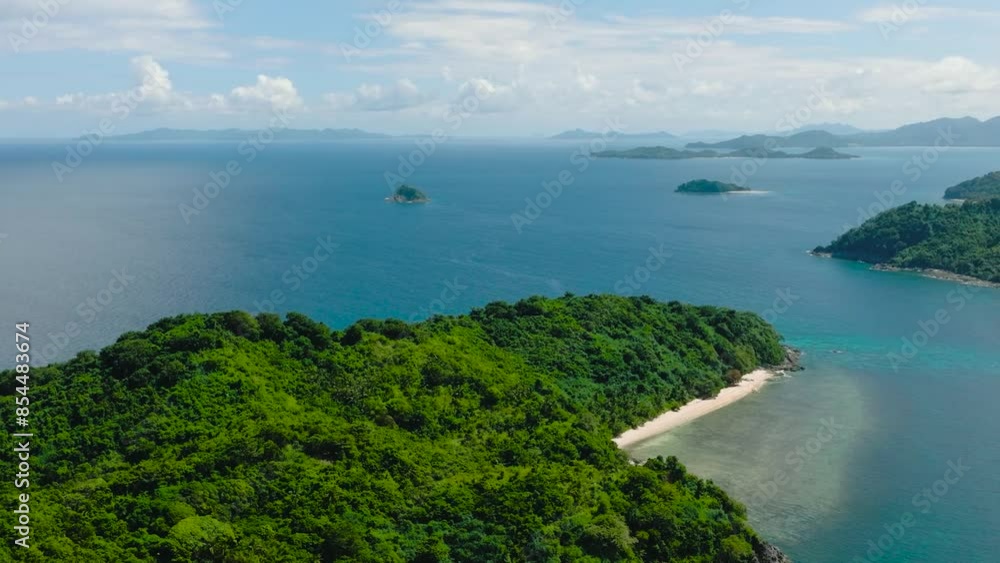 Islands with green plants and beach. Cagbuli Island in El Nido, Palawan. Philippines. Islands with green plants and beach. Cagbuli Island in El Nido, Palawan. Philippines.