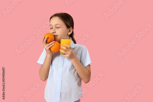 Cute little girl with orang...