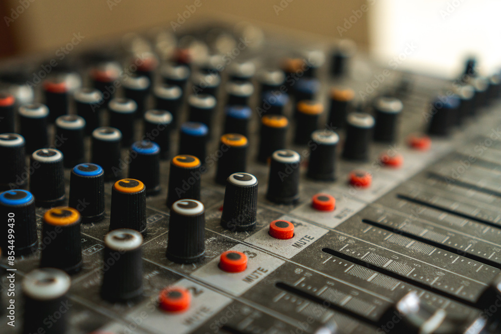 Dusty concert sound mixer panel with volume regulators, background and texture Dusty concert sound mixer panel with volume regulators, background and texture