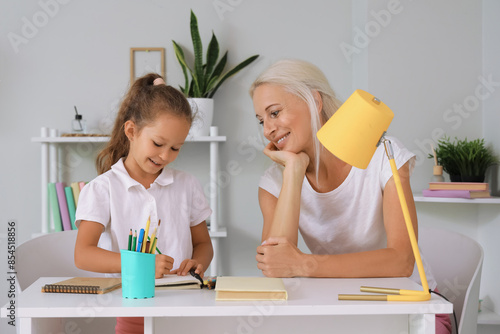 Little girl with her grandm...