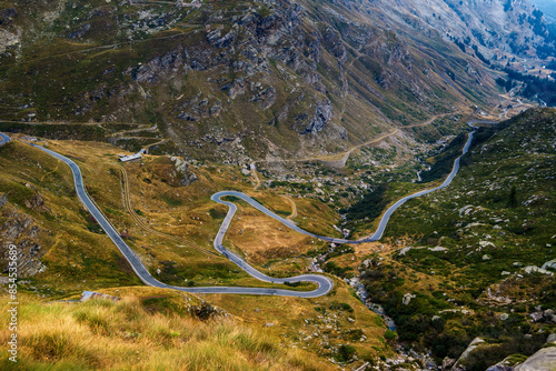 Alpine serpentine road in the valley in the mountains in Italy. photo