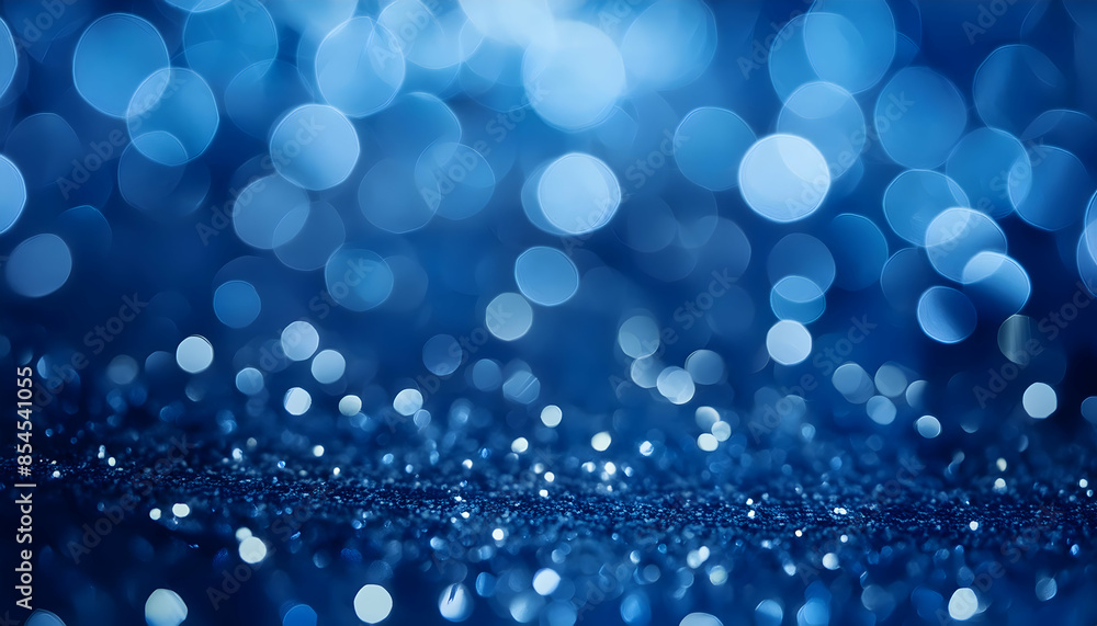 a rich, blue-toned abstract background with delicate bokeh circles and twinkling defocused glitters a rich, blue-toned abstract background with delicate bokeh circles and twinkling defocused glitters