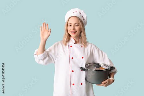 Beautiful young female chef...