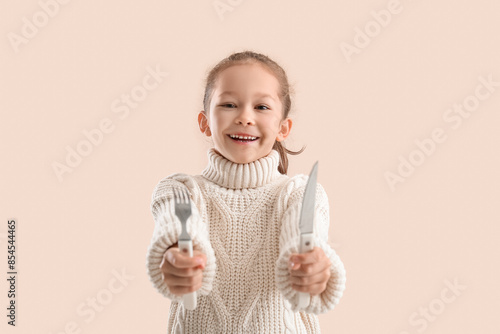Cute little girl with fork ...