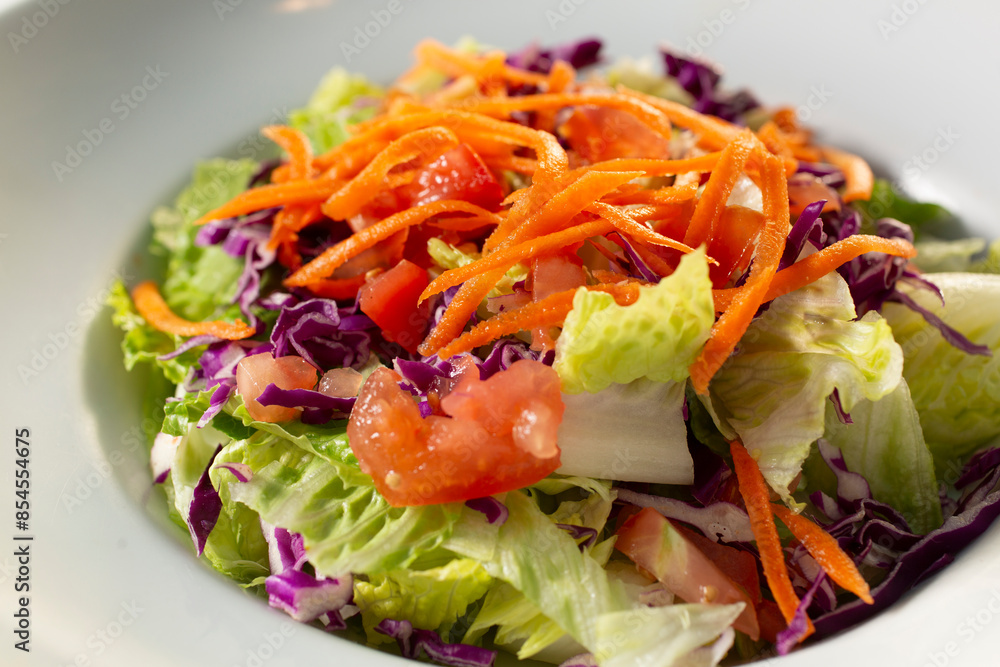 A closeup view of a house garden salad. A closeup view of a house garden salad.