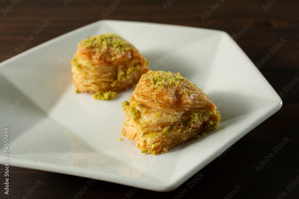 A view of two pieces of baklava. A view of two pieces of baklava.