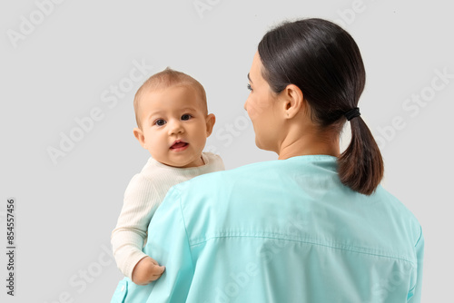 Female pediatrician with li...