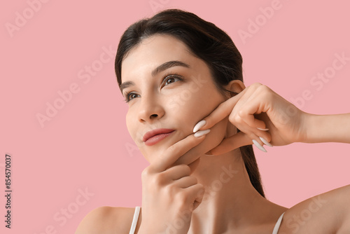 Beautiful young woman doing...