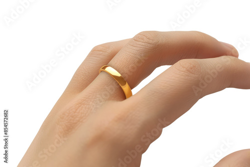 Close-up of a hand wearing a simple gold ring, showcasing elegant jewelry design. Perfect for wedding, engagement, and fashion themes.