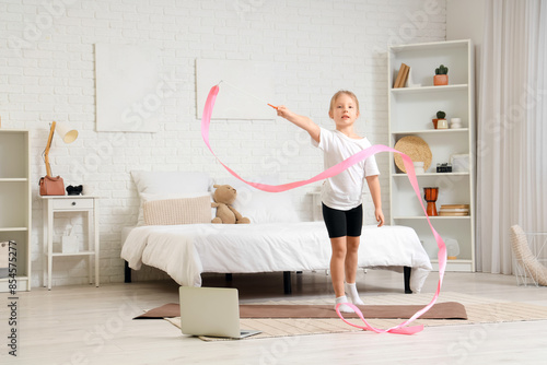 Cute little girl with mat a...
