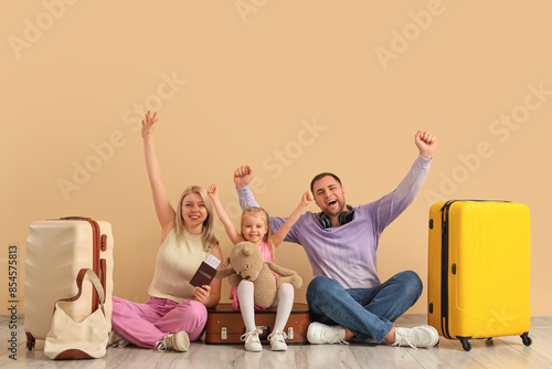 Happy family sitting with s...