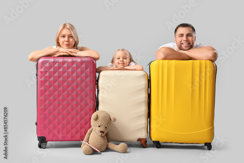 Happy family with suitcases...