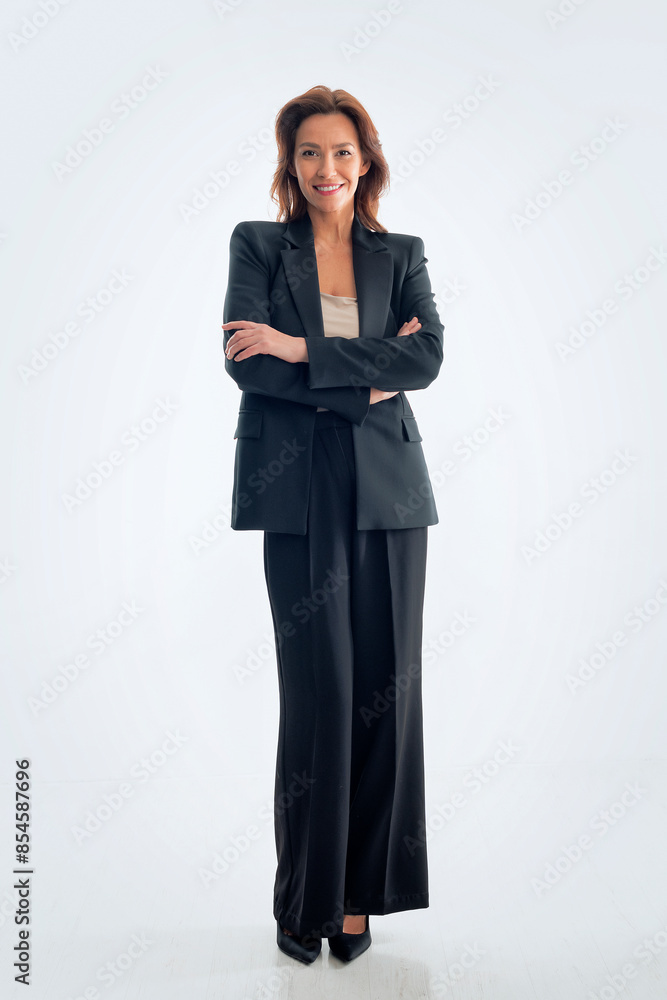 Attractive brunette haired woman standing at isolated white background Attractive brunette haired woman standing at isolated white background