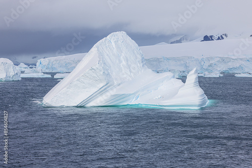 Icebergs along the coastline in the De Gerlache Strait which separates the Antarctic Peninsula from the Palmer Archipelago photo