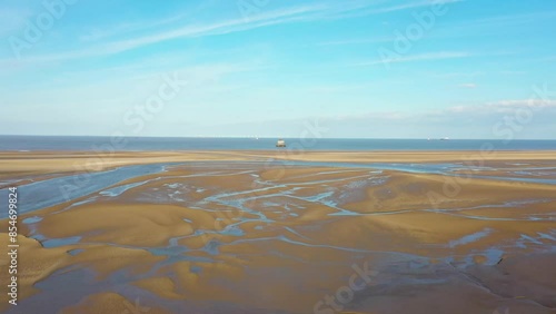 Aerial footage of a beach front in the town of Cleethorpes in Grimsby in the UK on a bright sunny day photo