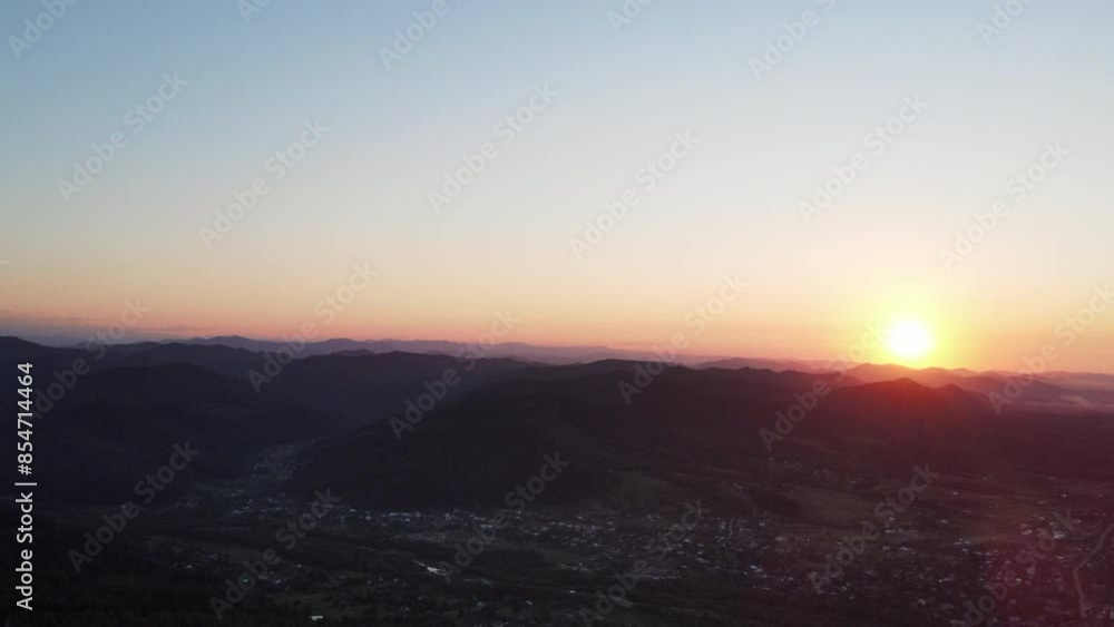 Aerial drone view of beautiful summer mountains and countryside during amazing sunset. Nature inspiration. Rural area on background summer landscape. Destination for tourism and wanderlust Aerial drone view of beautiful summer mountains and countryside during amazing sunset. Nature inspiration. Rural area on background summer landscape. Destination for tourism and wanderlust