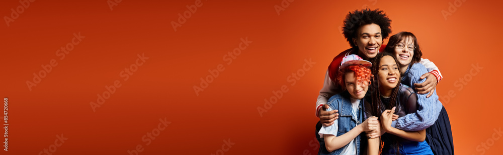 A diverse group of young friends, standing together in stylish attire in a studio setting.