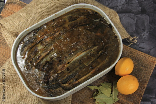 Fried whole lampreys on a plate, Fish delicacies, Latvian cuisine photo