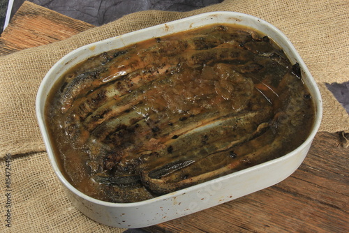 Fried whole lampreys on a plate, Fish delicacies, Latvian cuisine photo