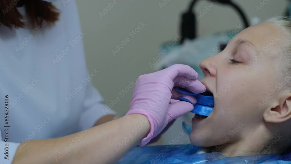 girl at the dentist, teeth cleaning procedure girl at the dentist, teeth cleaning procedure