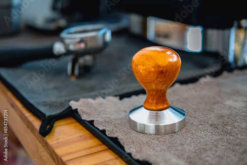 Coffee tamper equipment on table in a coffee shop of barista coffee tool photo