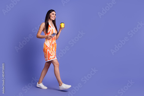 Photos Full lengh photo of sweet shiny lady wear dress enjoying beverage texting gadget