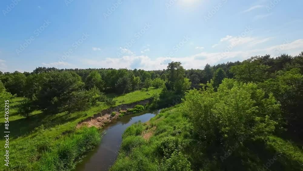 Low and fast FPV drone flight over the river among the trees. Low and fast FPV drone flight over the river among the trees.