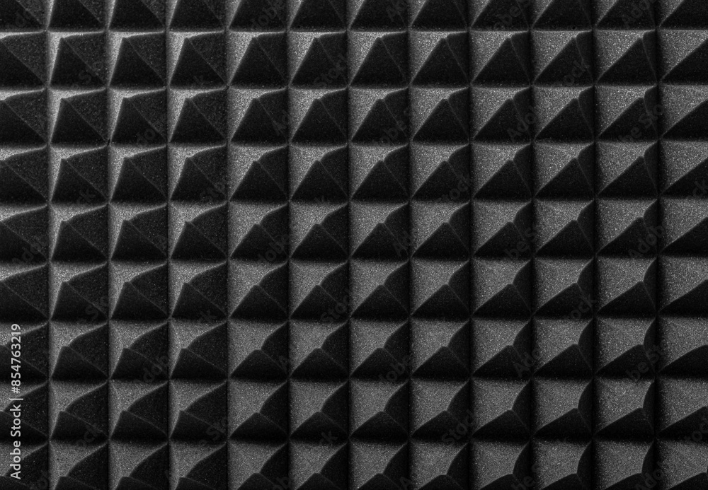 Black acoustic foam as an abstract background.