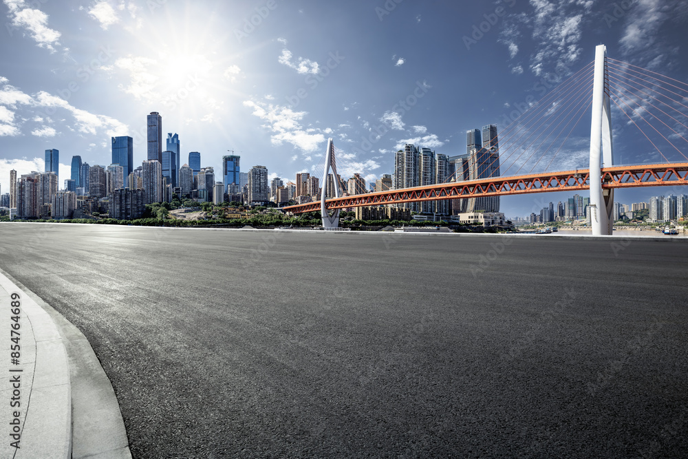Empty asphalt road and cityscape in modern city Empty asphalt road and cityscape in modern city