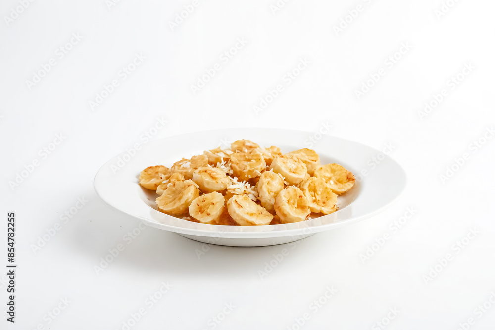 Fried Banana with Coconut Flakes on White Plate Fried Banana with Coconut Flakes on White Plate