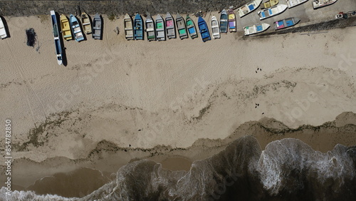 Konstfotografi Small wooden boats for fishing on the beach sand