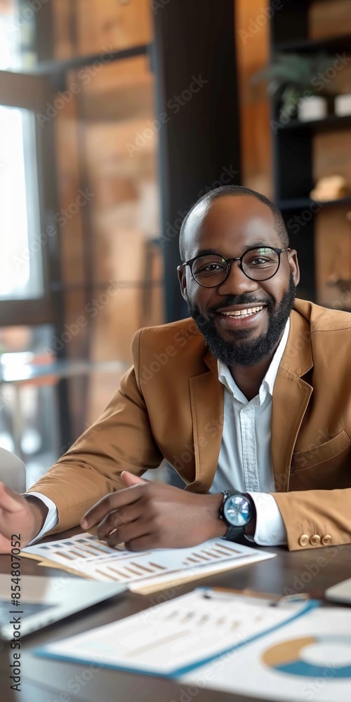A cheerful and confident executive, dressed in a stylish suit and glasses, smiles while holding paperwork, embodying success and professionalism. A cheerful and confident executive, dressed in a stylish suit and glasses, smiles while holding paperwork, embodying success and professionalism.