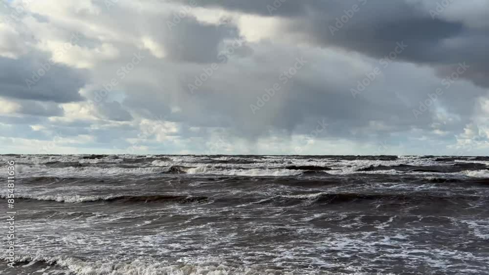 Stormy waves and dramatic sky at the beach Stormy waves and dramatic sky at the beach