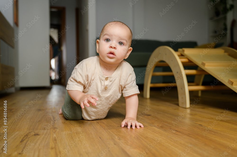 Caucasian toddler exploring home intently Caucasian toddler exploring home intently