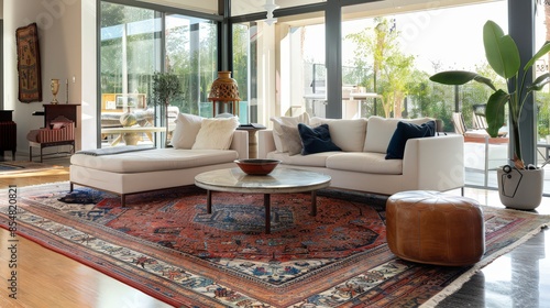 Rugs in the living room add warmth and define different areas within the space. © kaitanan