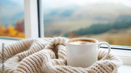Coffee Break with a View, A coffee mug placed on a window sill with a stunning view outside Casual attire like a cozy sweater or a knitted scarf photo