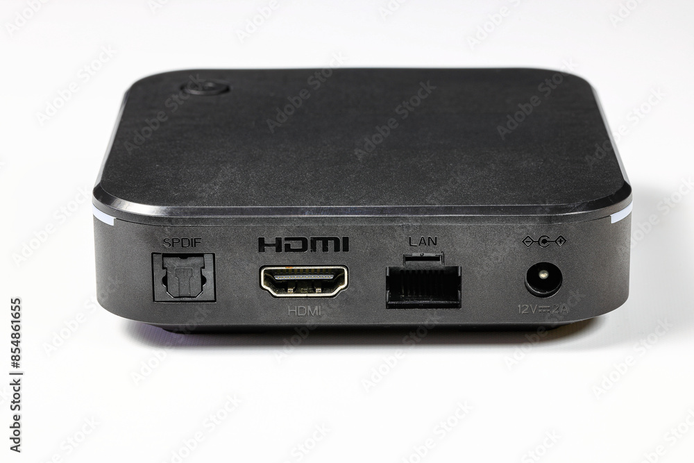 multiple ports or connectors LAN, HDMI, SPDIF of tiny computer or multimedia box or android box isolate on white background. multiple ports or connectors LAN, HDMI, SPDIF of tiny computer or multimedia box or android box isolate on white background.